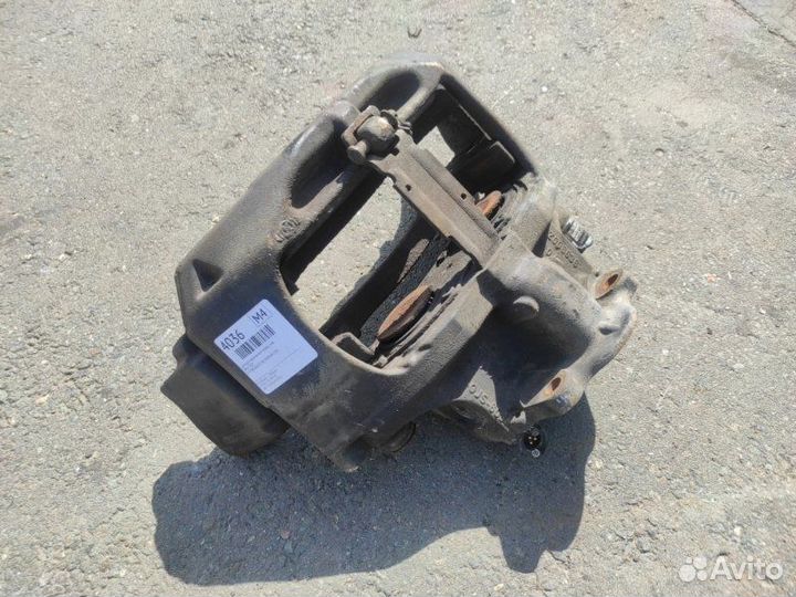 Суппорт тормозной передний левый Man Tgx