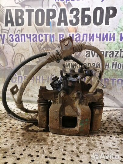 Суппорт тормозной задний левый Mitsubishi Outlande