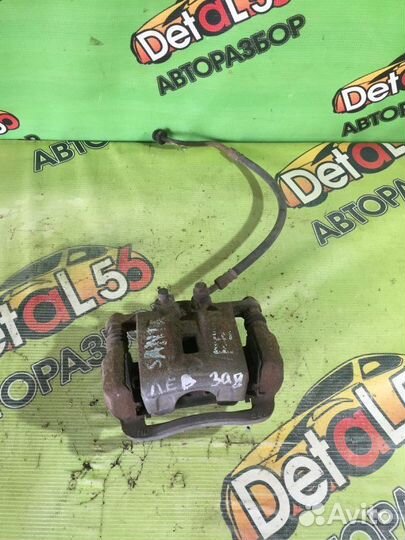 Суппорт тормозной задний левый Hyundai Santa Fe CM