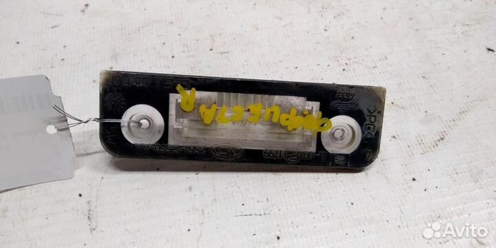 Фонарь подсветки номера Ford