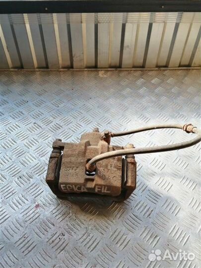 Суппорт тормозной передний левый Chevrolet Epica