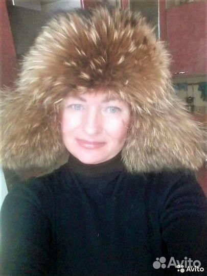 Кожаная ушанка с енотом