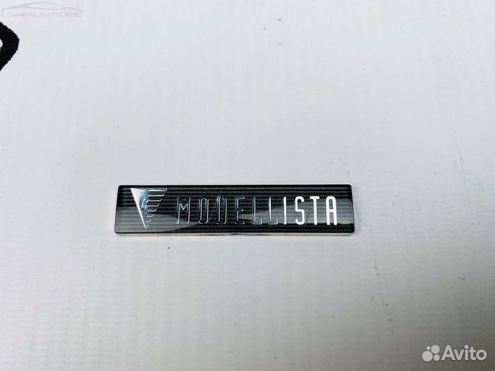 Эмблема Modellista E8614