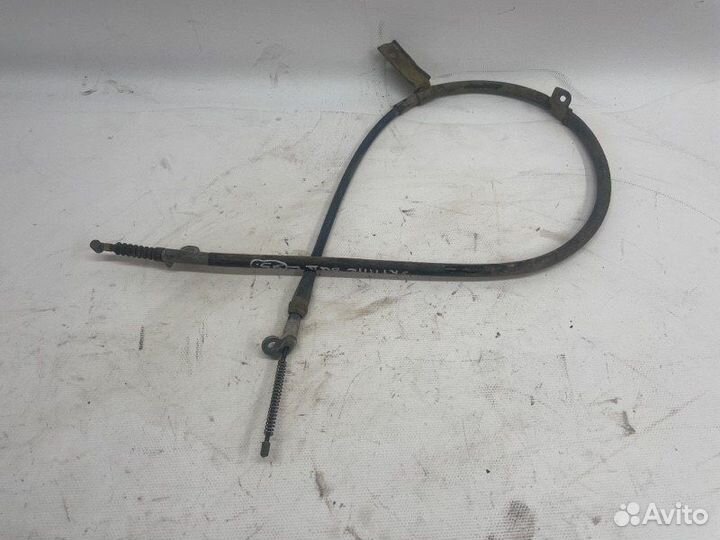 Трос стояночного тормоза задний левый Nissan