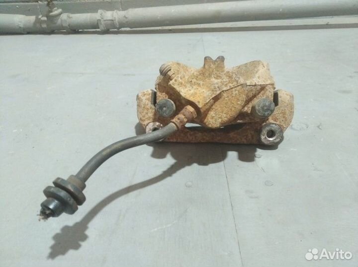 Суппорт тормозной передний левый Renault Duster