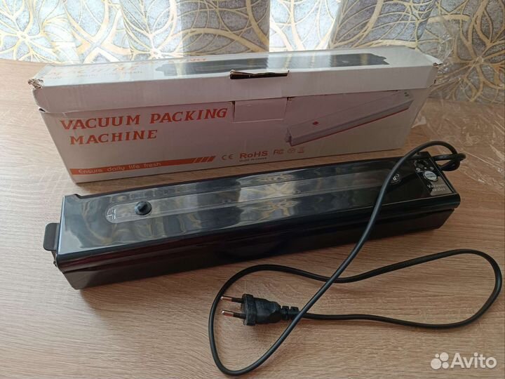 Вакуумный упаковщик