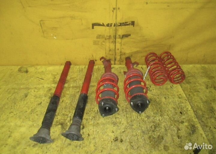 Стойки autoexe mazda demio 2003 год