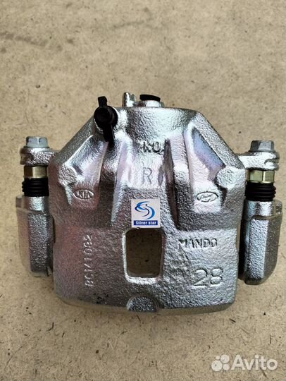 Суппорт передний правый Sportage Tucson 2004-2010