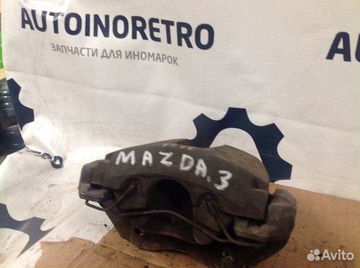 Суппорт тормозной передний правый Мазда. 3