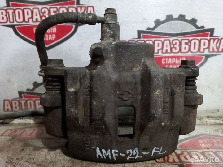 Суппорт тормозной передний левый Nissan Atlas