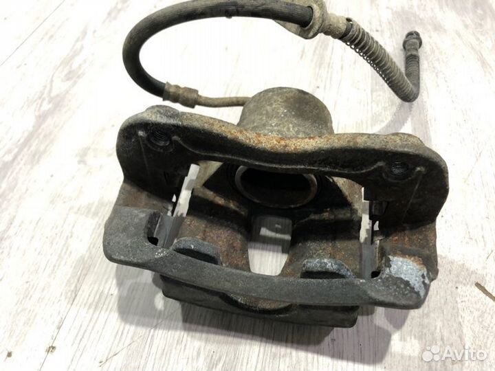 Суппорт тормозной передний левый Kia Rio 3 G4FA