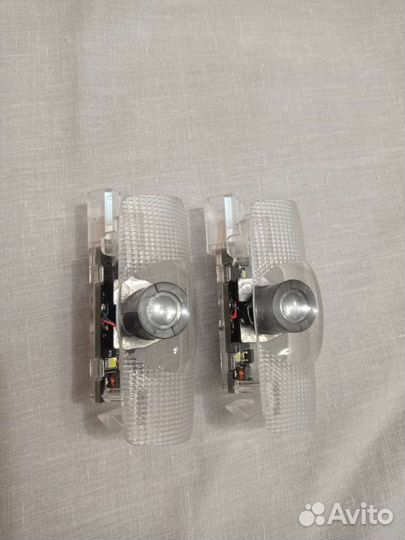 Подсветка в дверь тойота камри