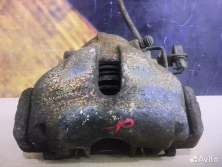 Суппорт тормозной передний левый Audi A6. C5