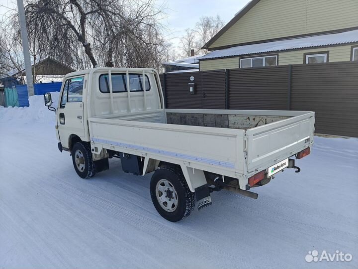 Бортовой грузовик Nissan Atlas, 1990