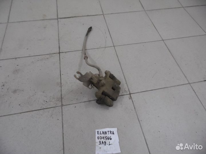 Суппорт тормозной задний левый Hyundai Elantra 200