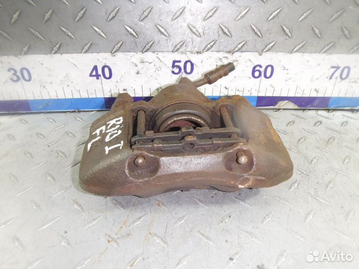 Суппорт тормозной передний левый Kia Rio