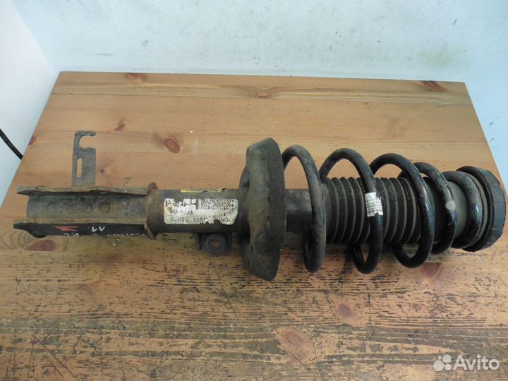 Стойка (амортизатор) в сборе левая Опель Астра J