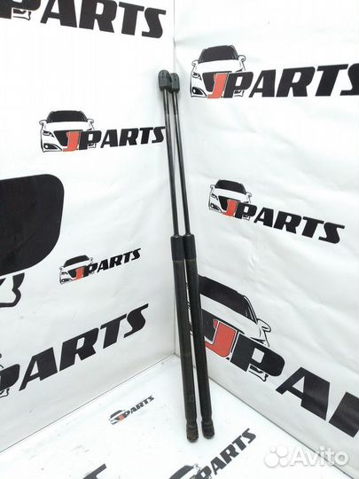 Амортизатор двери багажника Mazda 3