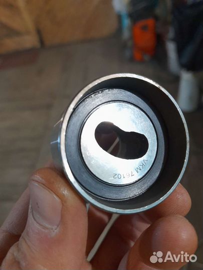 Ролик натяжителя ремня грм Лансер 9