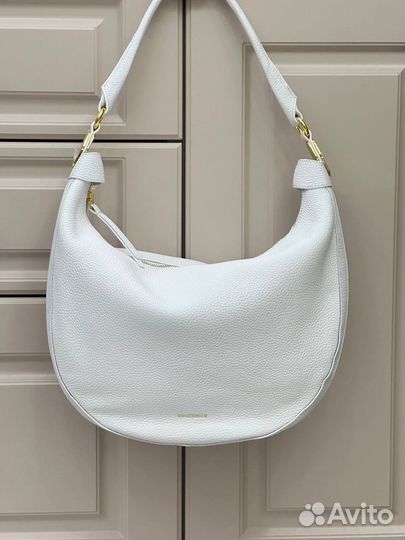 Женские сумки хобо Coccinelle