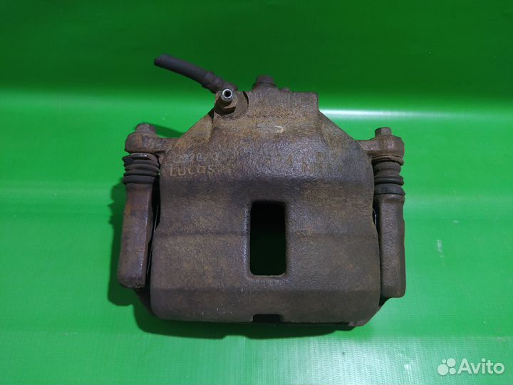 Суппорт передний правый Nissan Almera N16