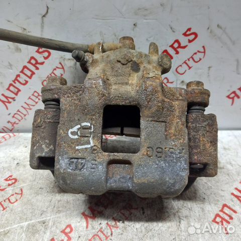 Суппорт тормозной передний Mitsubishi Lancer 9