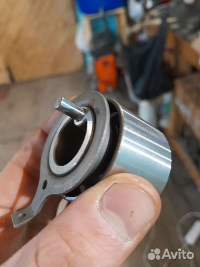 Ролик натяжителя ремня грм Лансер 9