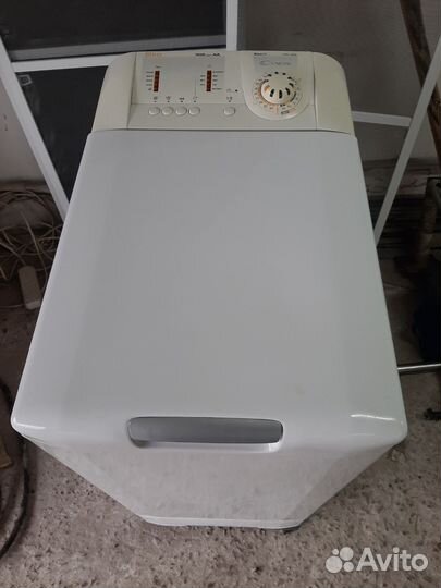 Стиральная машина с вертикальной загрузкой канди