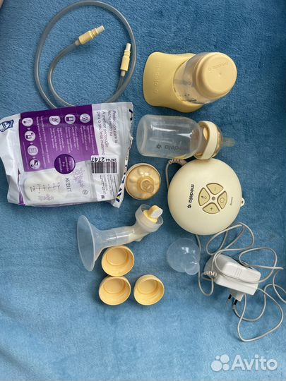 Молокоотсос medela swing