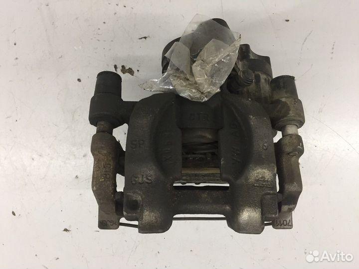 Суппорт задний левый (Volkswagen Passat)