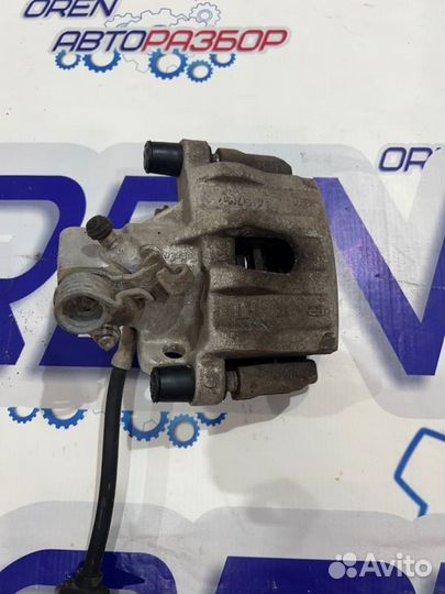 Суппорт тормозной задний левый Ford Focus 3