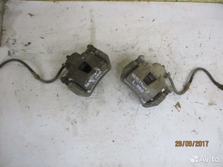 Суппорт передний Шевроле Лачетти