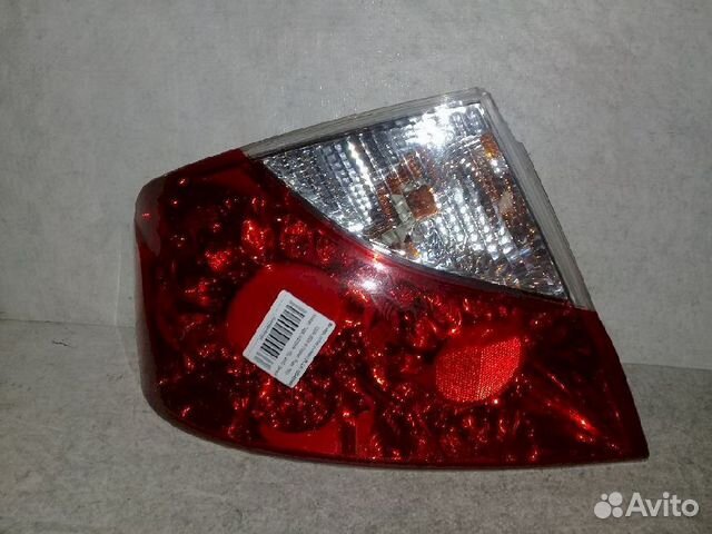 Фонарь (стоп сигнал) задний левый 220-63989 левый