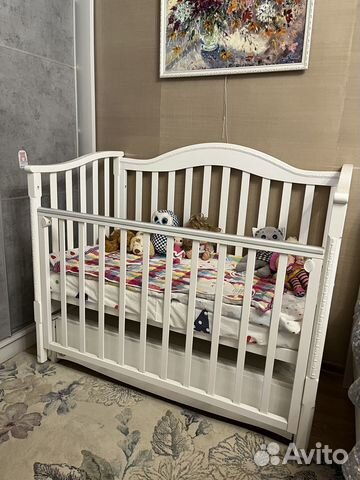 Детская кроватка с продольным маятником