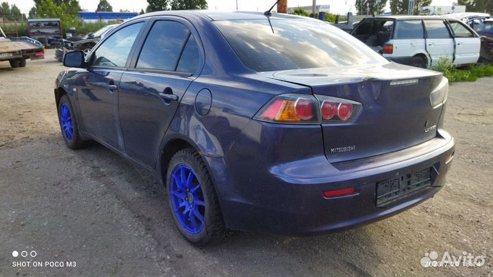 Компрессор кондиционера Mitsubishi Lancer 10