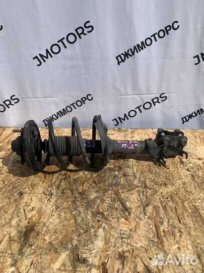 Амортизатор передний левый Mitsubishi Outlander Xl