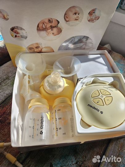 Молокоотсос двойной medela swing maxi