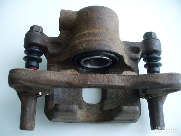 Суппорт задний правый Lancer 9 (новый ремкомплект)