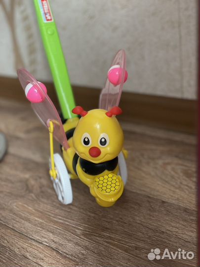 Игрушка каталка с ручкой