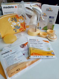 Молокоотсос ручной, накладки на грудь и пакеты для